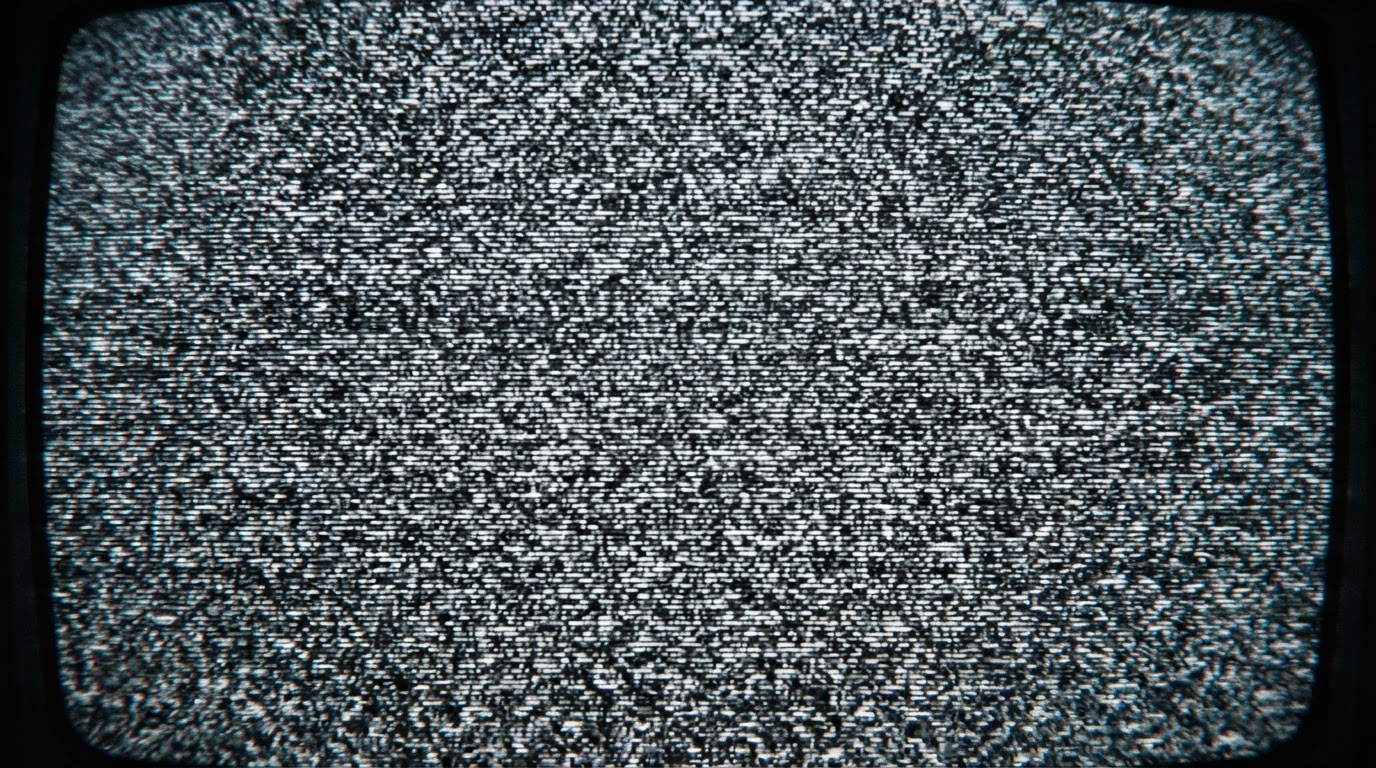 Extreme close-up of grey and white television static filling the entire frame