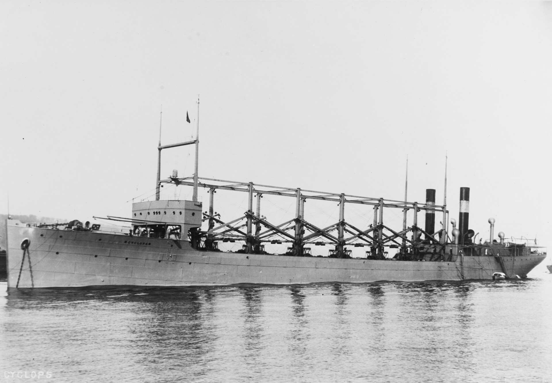 The USS Cyclops seen broadside — her name lettered on the hull, and the distinctive cranes that defined her silhouette.