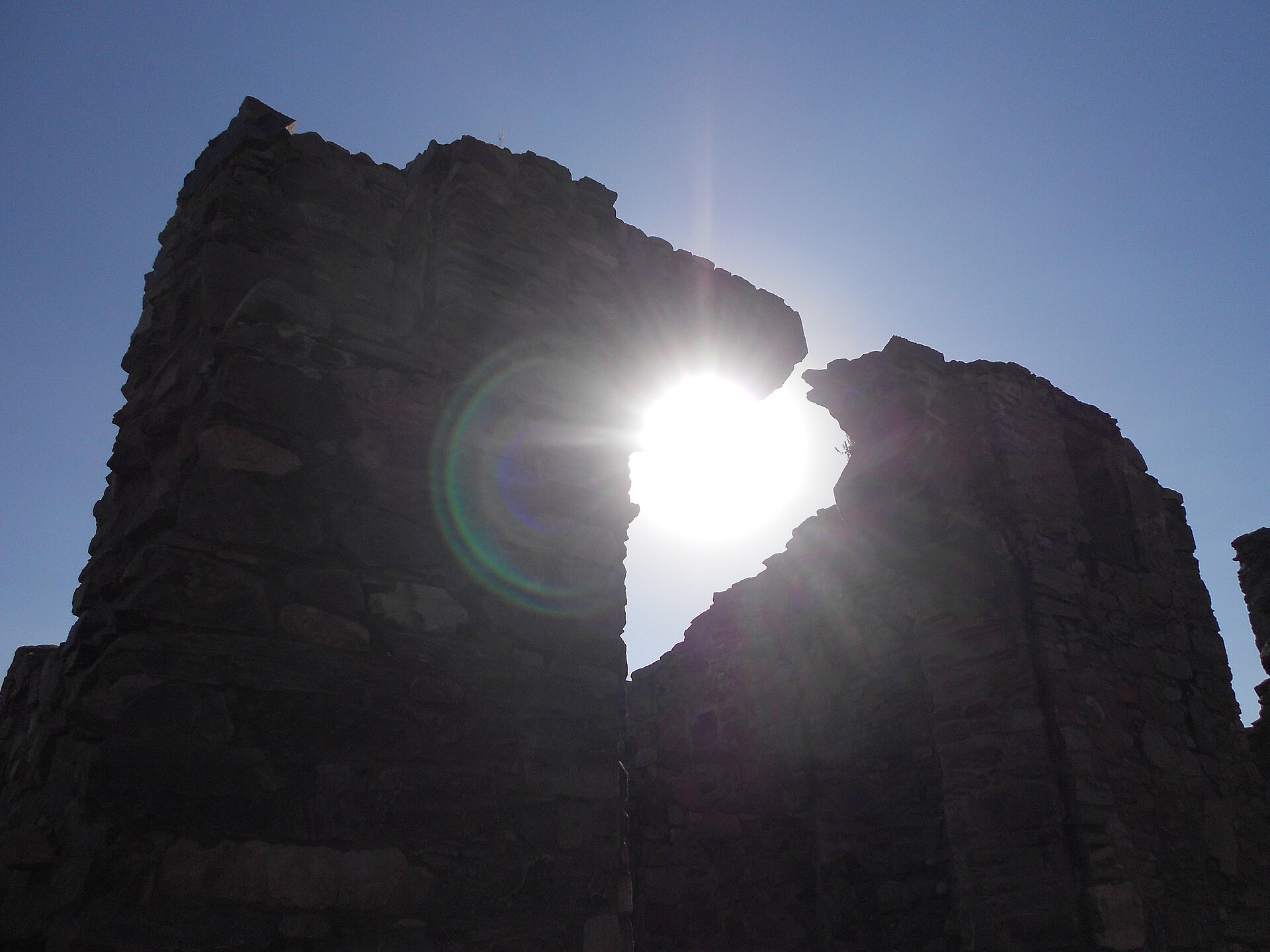 The ruins of the Bhangarh ghost town seen from another angle, its stone buildings stripped of their roofs