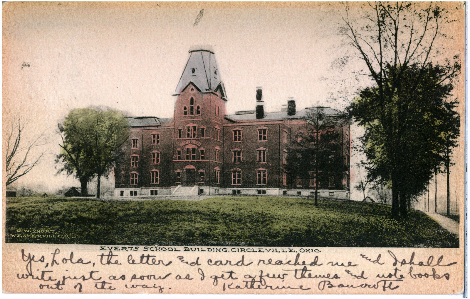 An old postcard of the Everts School in Circleville, with a handwritten message still filling the margin