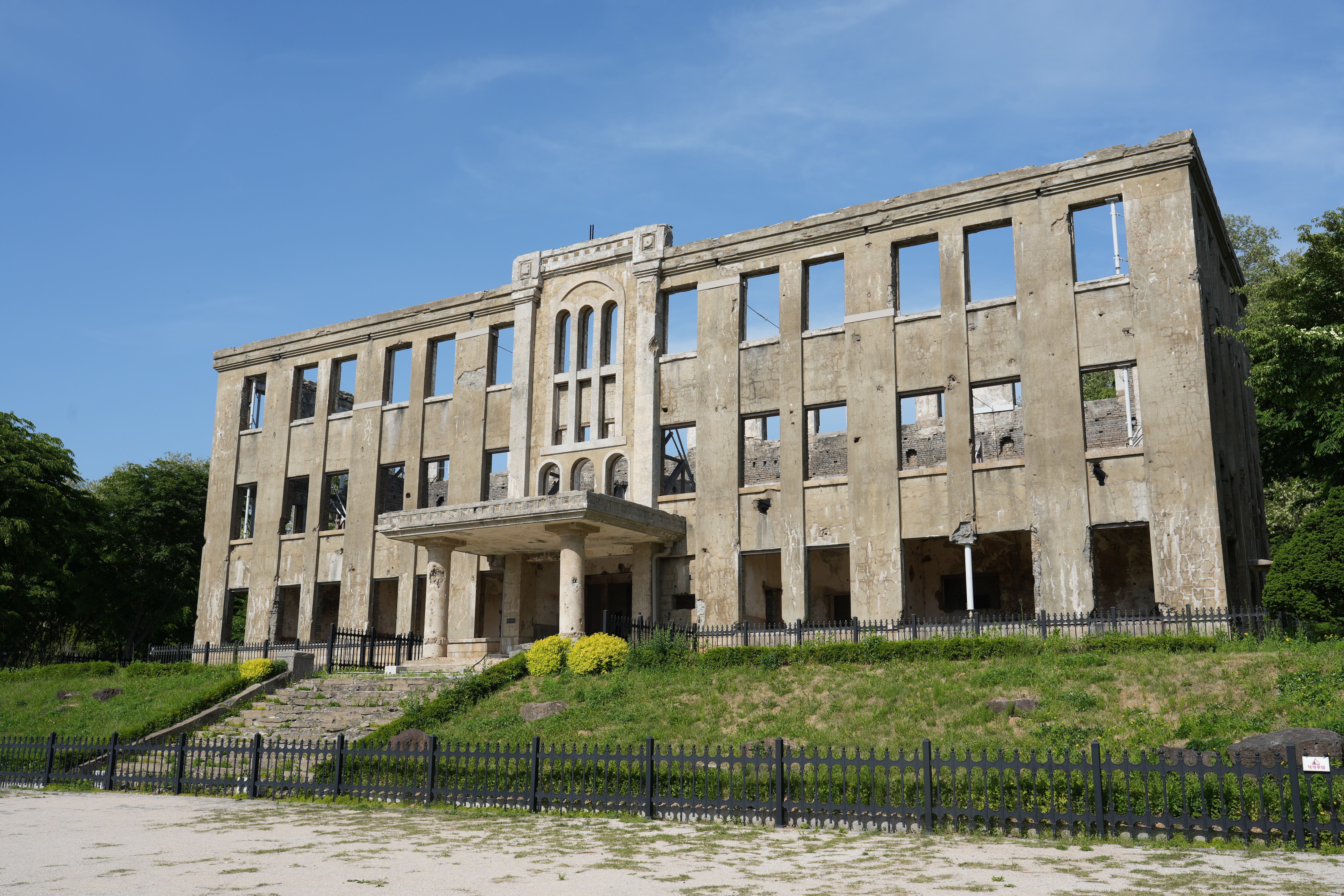 The Cheorwon Workers' Party Hall — clawed by the war, the building stands frozen in that era, only its skeleton left.