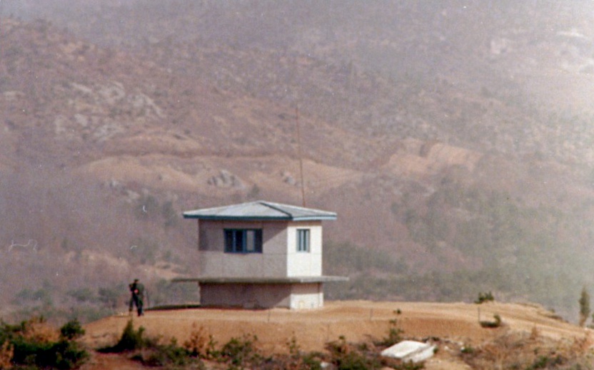 At dusk — a lone guard post standing on the ridge.
