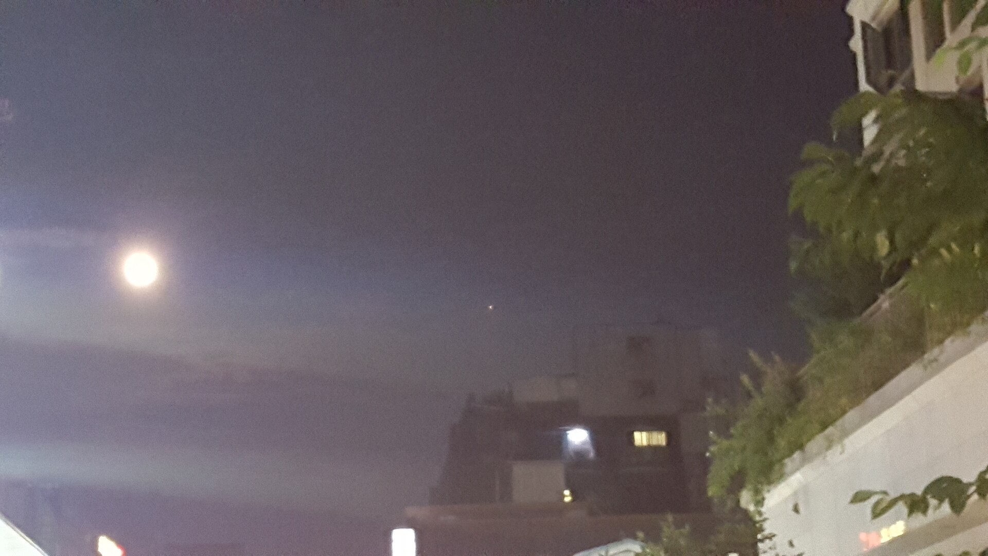 The Moon and Mars together in the night sky over Seoul — bright planets like these are the most common answer behind misidentified UFO reports in Korea.