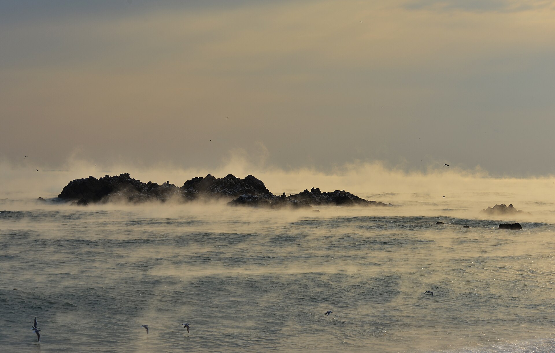 The Underwater Tomb of King Munmu in sea fog, the rocky islet half-drowned in mist