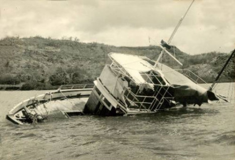 The MV Joyita under tow after being found in 1955, listing heavily to port and half-swamped, as she was discovered