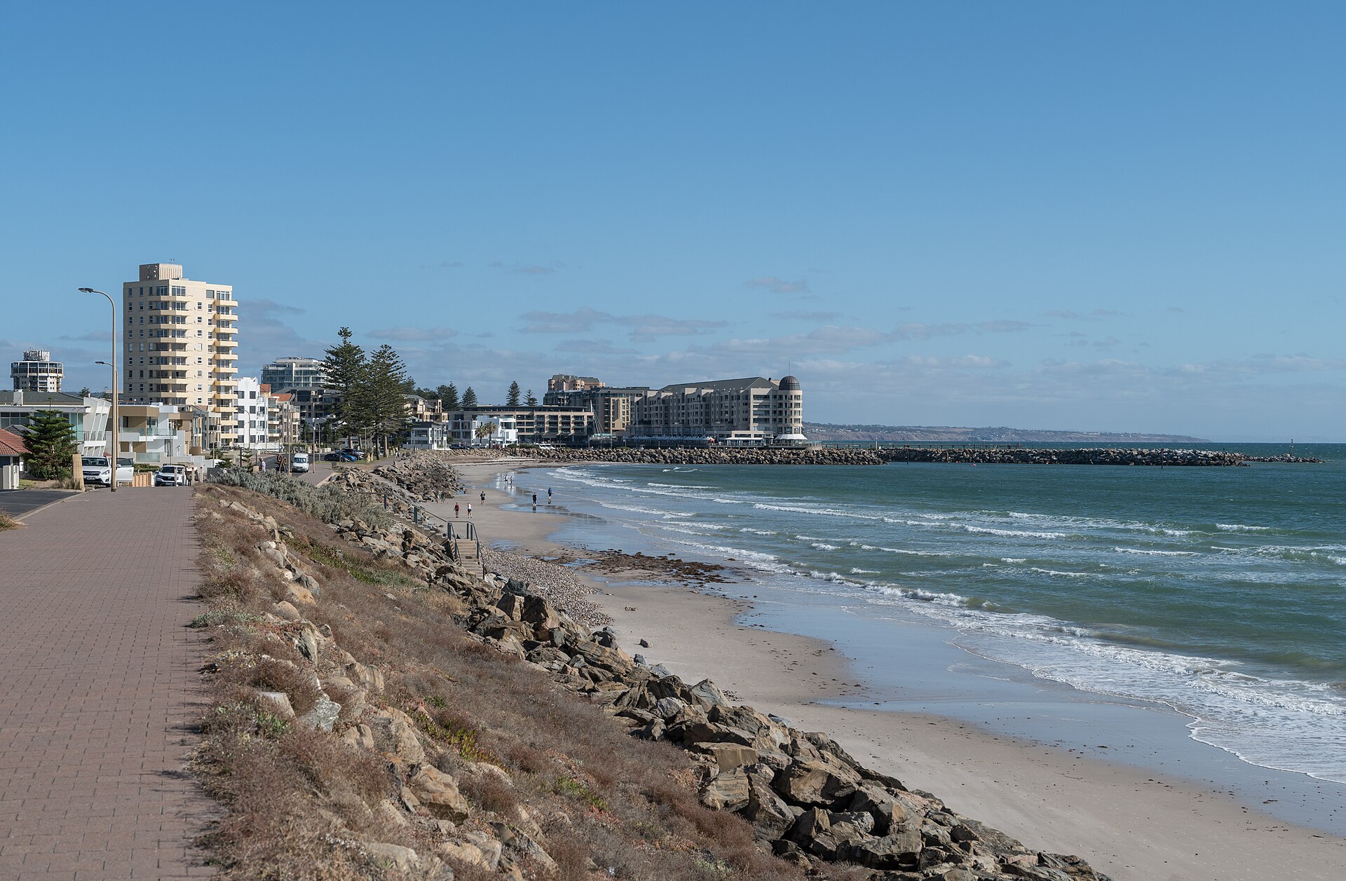 Glenelg and Somerton beach in Adelaide as it looks today — the seawall, the sand, and the foreshore promenade where the body was found