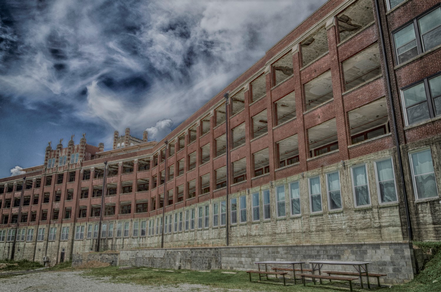 Waverly Hills Sanatorium in 2018 — the five-story brick wards stretching along the hilltop, their windows torn out