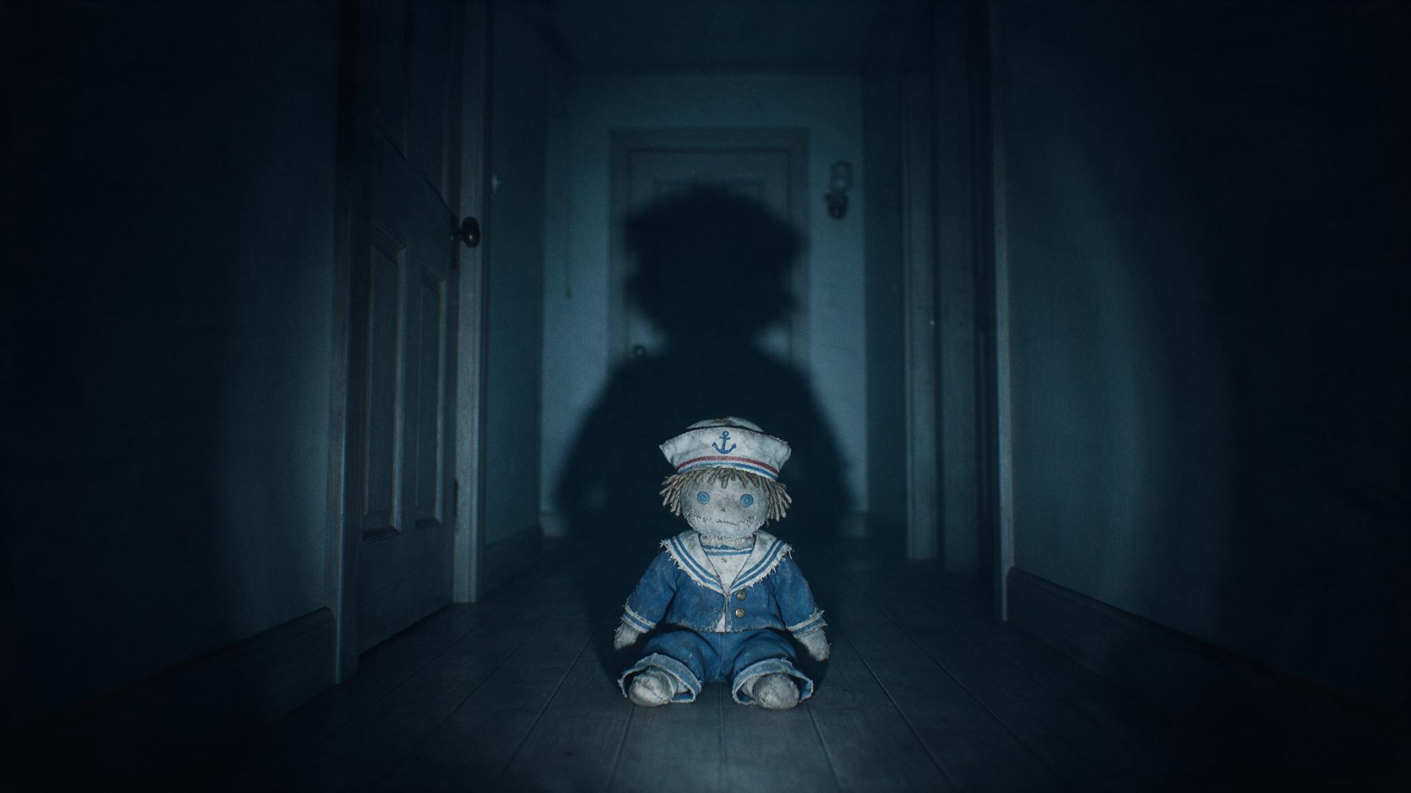 The end of a dark hallway, an old stuffed doll seated on the floor staring straight ahead, a long shadow thrown across the wall, a cold air of formless dread